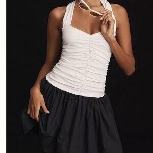 Stylish White Halter Top with Black Skirt